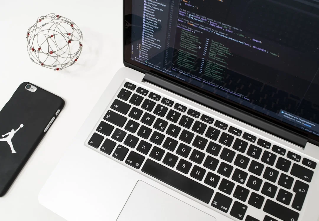 A contemporary workspace with two computer monitors showing web design projects, highlighting technology and productivity.
